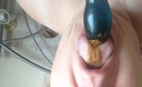 Licking a big black dildo