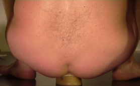Shitting on a dildo 