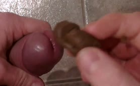 Stroking his cock with poop on it