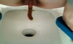Tranny shitting in a turkish toilet