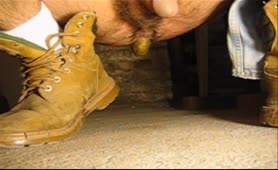 Teen boy pooping a big turd on the garage floor