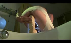 Jumping hard on a long dildo made him cum