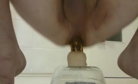 Riding a long dildo while pooping on top of it