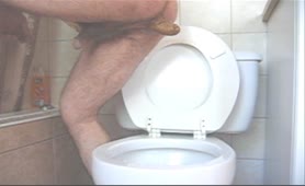Big turd from hairy boy over toilet