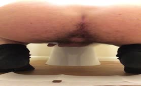 Muscular British boy pooping on bedroom floor