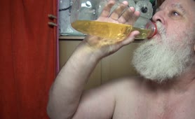 Old guy drinking his own piss