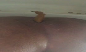 Ebony guy shitting in toilet
