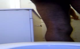 Black guy shitting in toilet