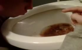 Sick guy puking in toilet