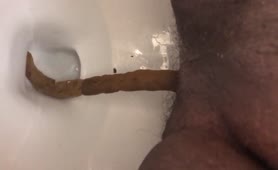 Ebony guy shitting in toilet