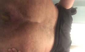 Hairy guy shitting in close up