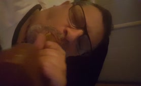 Licking shit from a long dildo