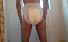 Shitting solo in white diapers