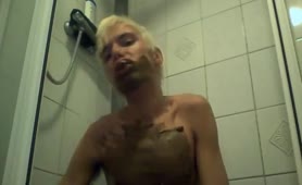 Blonde twink smears shit on naked body
